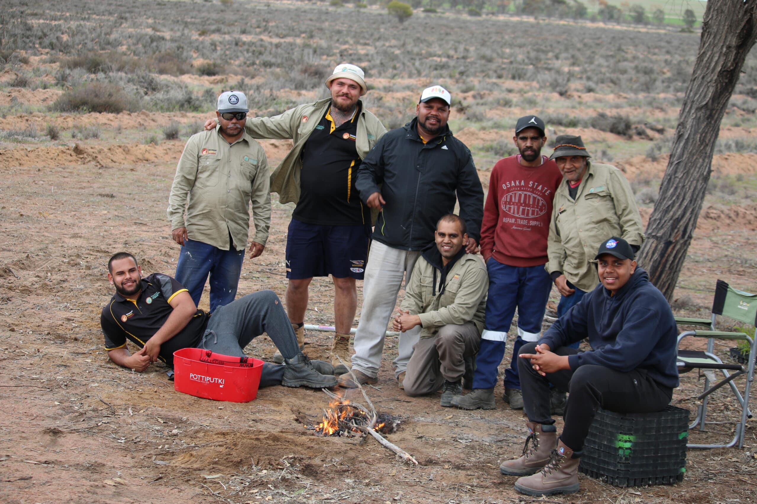 Group photo with planting equipment