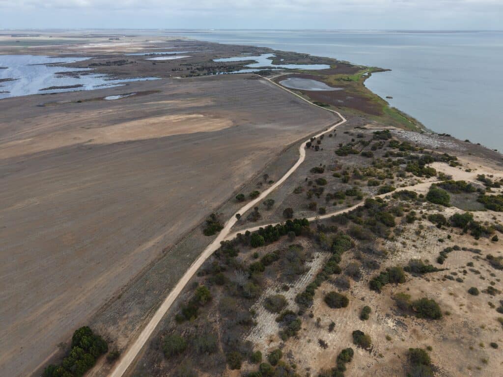 Drone image of cleared land in between areas of remnant vegetation.