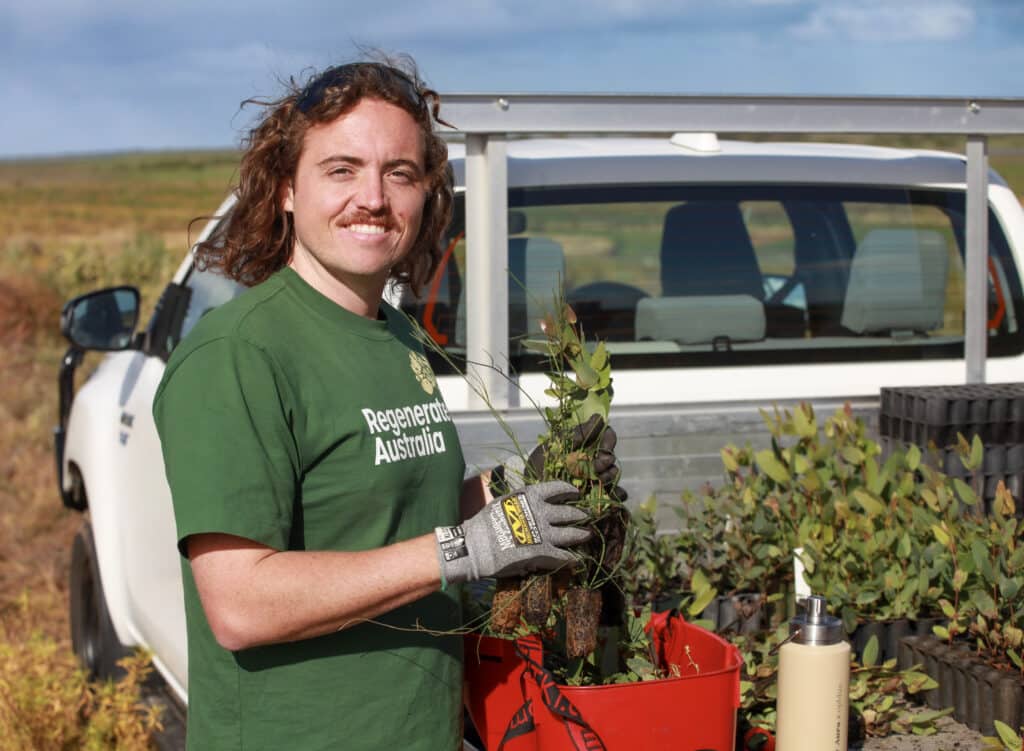 Sam-Regional-Restoration-planting-native-trees Sam on site planting native Australian trees for land regeneration